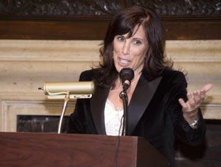 Merle Hoffman speaks at the Harvard Club.